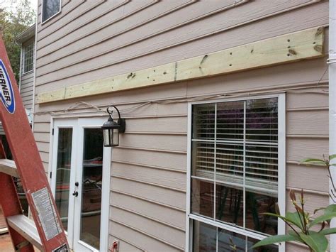 Most tar paper has parallel lines already marked on it. . How to attach a patio roof to a house with vinyl siding